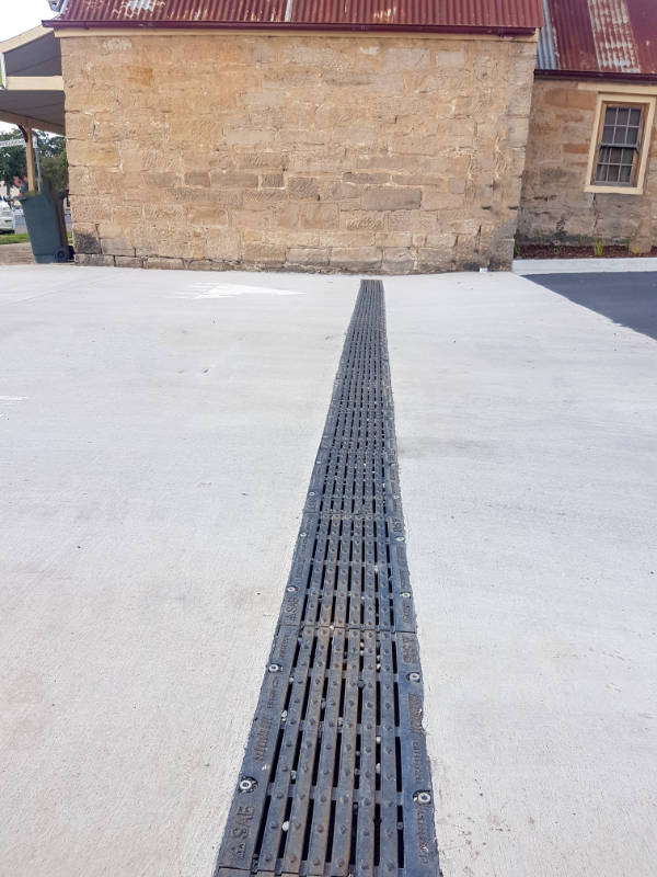 SABDrain class D cast iron drainage for use as driveway drainage, highway use, loading docks, schools & more. featuring a lockdown system and heel guard grate.